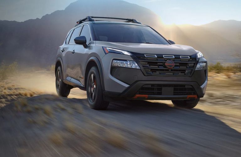 Nissan Rogue front view on a dirt road