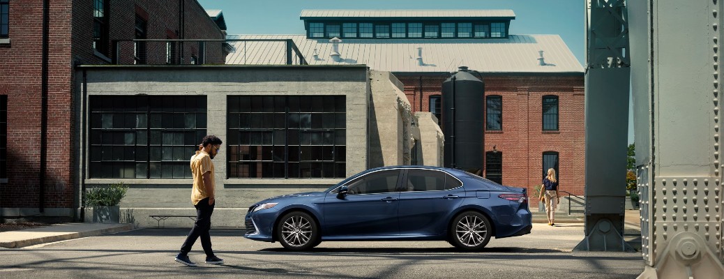 2024 Toyota Camry side view in a city