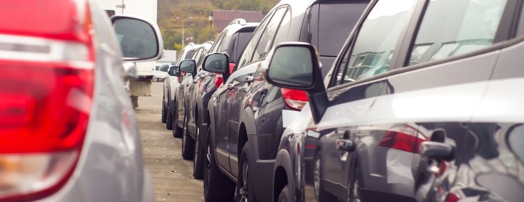 Several cars parked at a parking lot