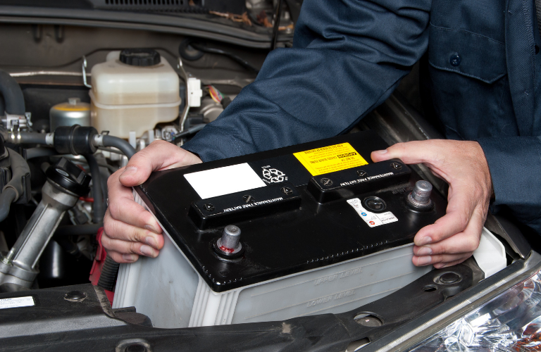 Mechanic changing the battery