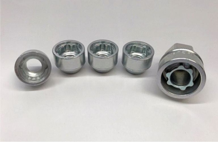 Kia parts lined up on a blank surface