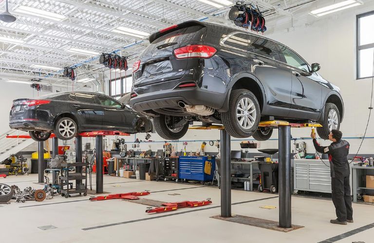 Vehicles lifted in the air at a Kia service center