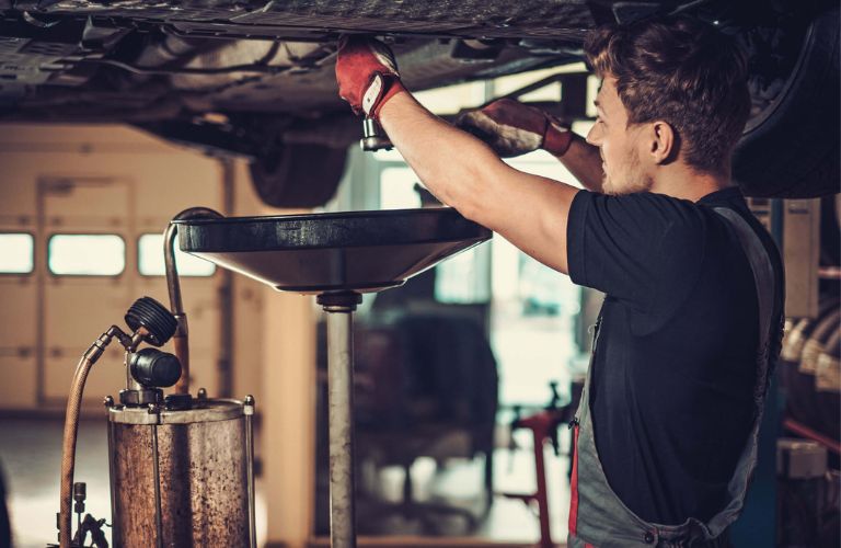 A mechanic working on a vehicle