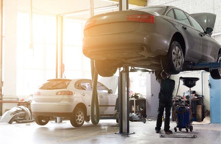 A mechanic working on a vehicle