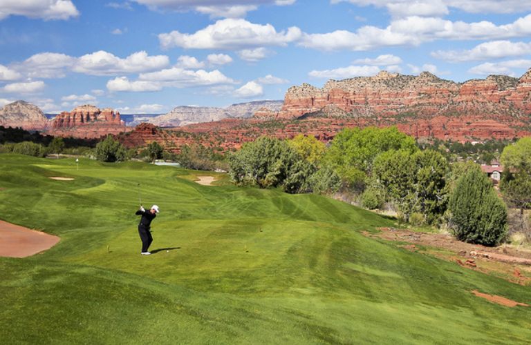 A man playing golf