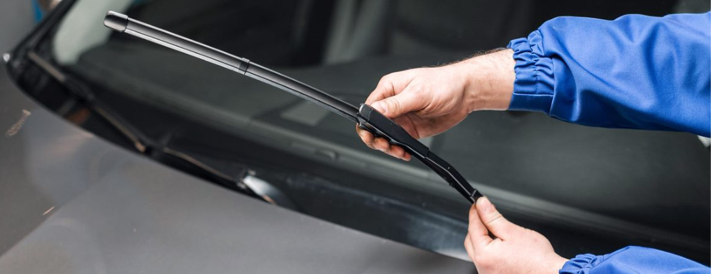 A mechanic inspecting a wiper