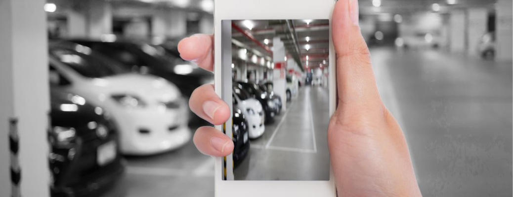 A man using the phone at a dealership