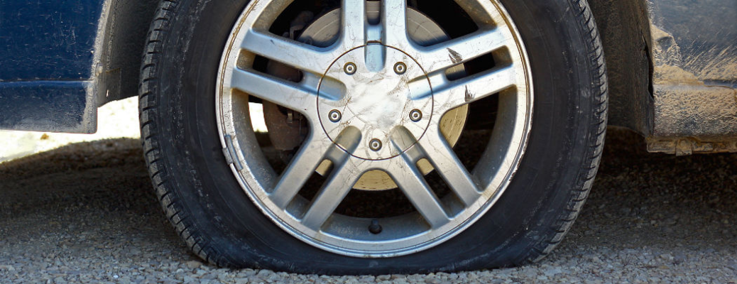 A close up of a flat tire