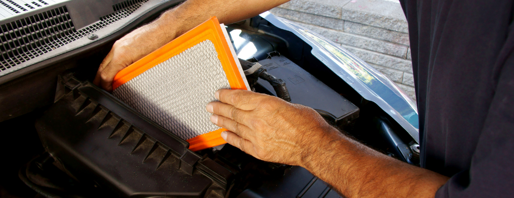 Man replacing a dirty air filter