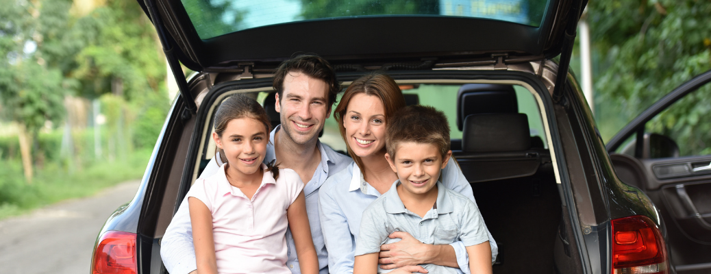 A happy family in a vehicle