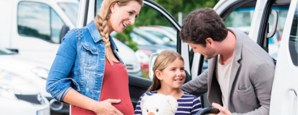 A family near a car