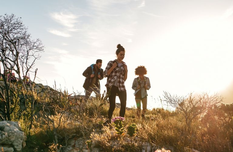 3 people hiking outdoors