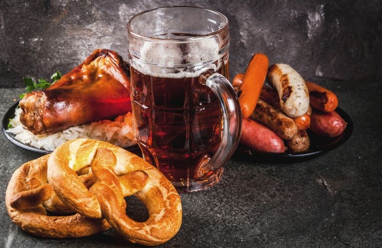 A drink and pretzels on the table