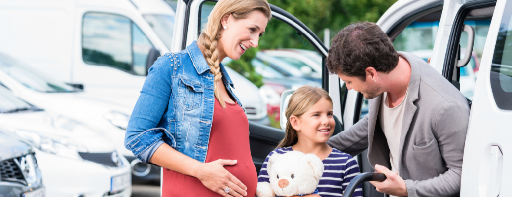 A family near a car