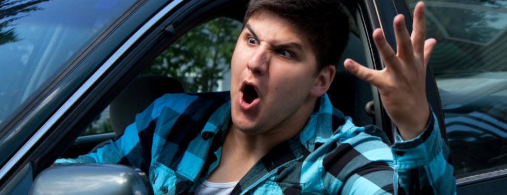 Angry man looking for a vehicle's window