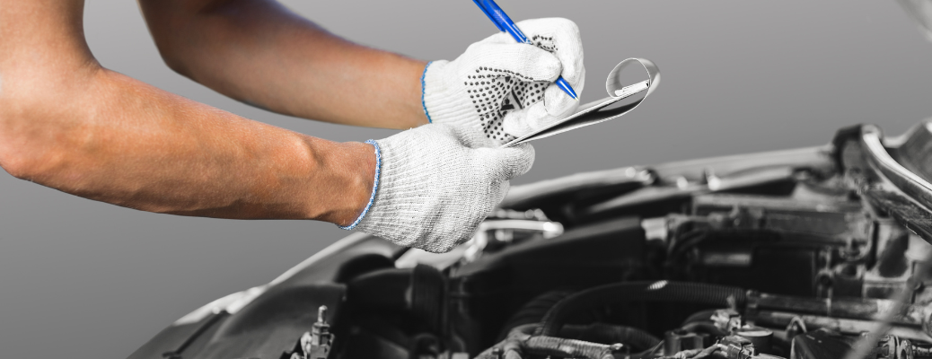 Mechanic inspecting a vehicle