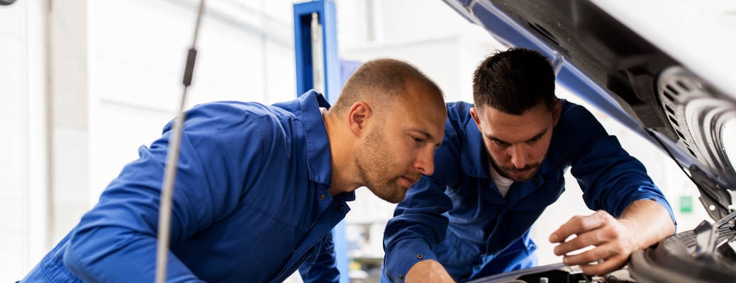 Mechanics checking a vehicle