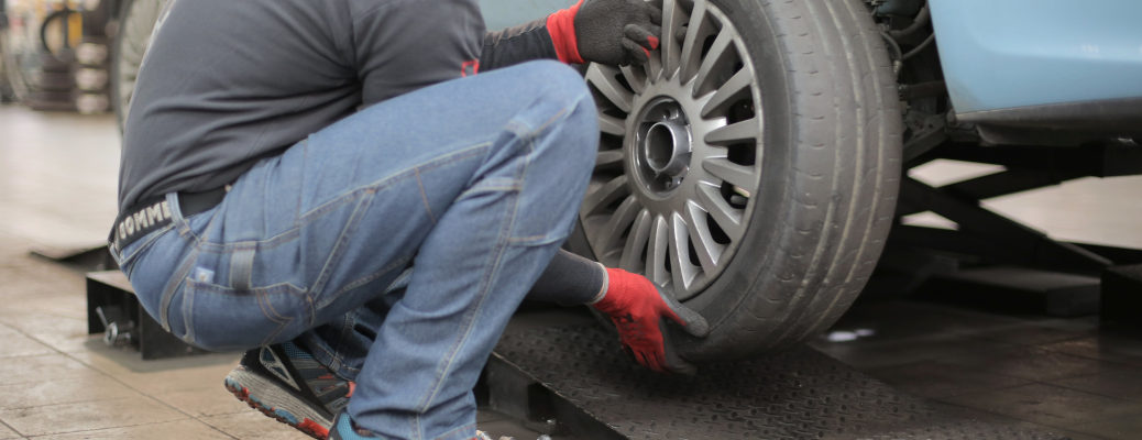 A man changing tires