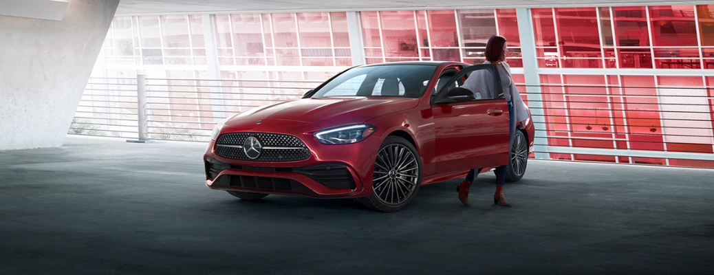 A woman coming out of the 2022 Mercedes-Benz C-Class