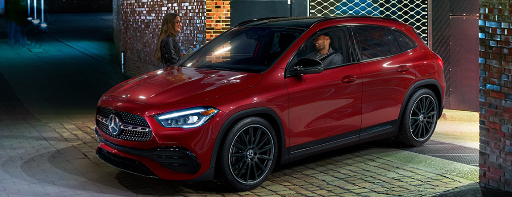 A woman standing near the 2022 Mercedes-Benz GLA