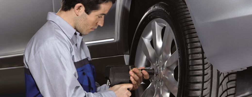 A mechanic checking tire