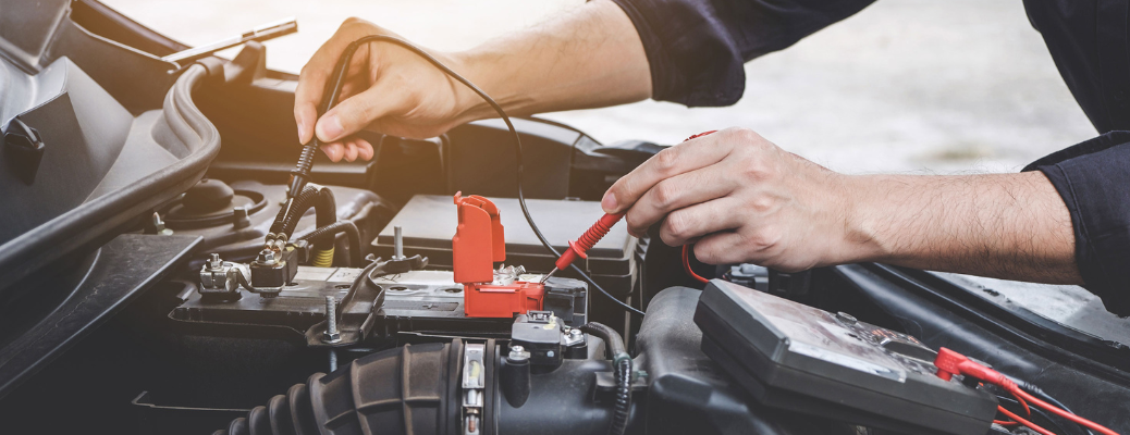 Mechanic checking a vehicle's battery