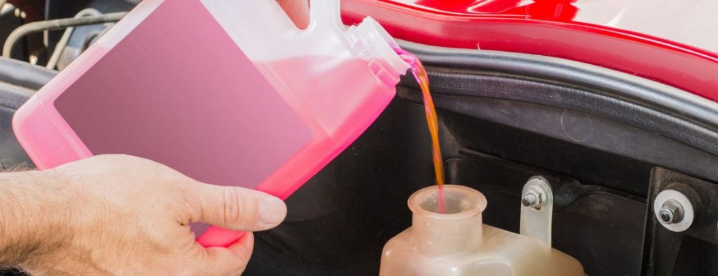 A man pouring liquid