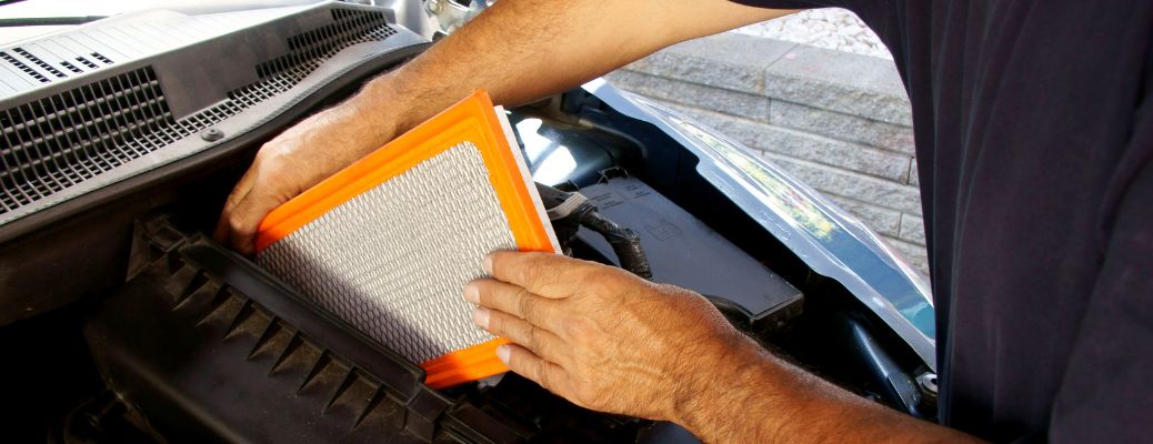 Hands of a man changing filter