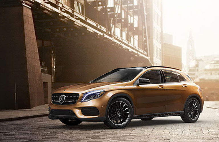 Side view of the 2017 Mercedes-Benz GLA parked near a building 