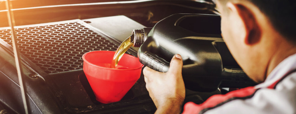A man pouring oil