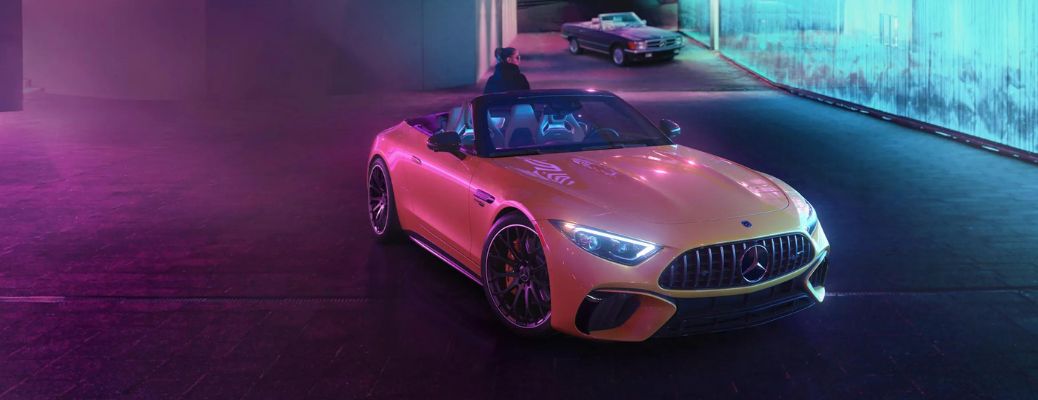 aerial front view image of the 2024 Mercedes-Benz AMG SL 43 Roadster at night-A_o