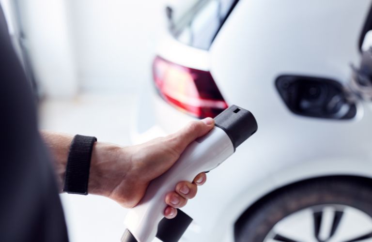 representative image of a hybrid going to get charged