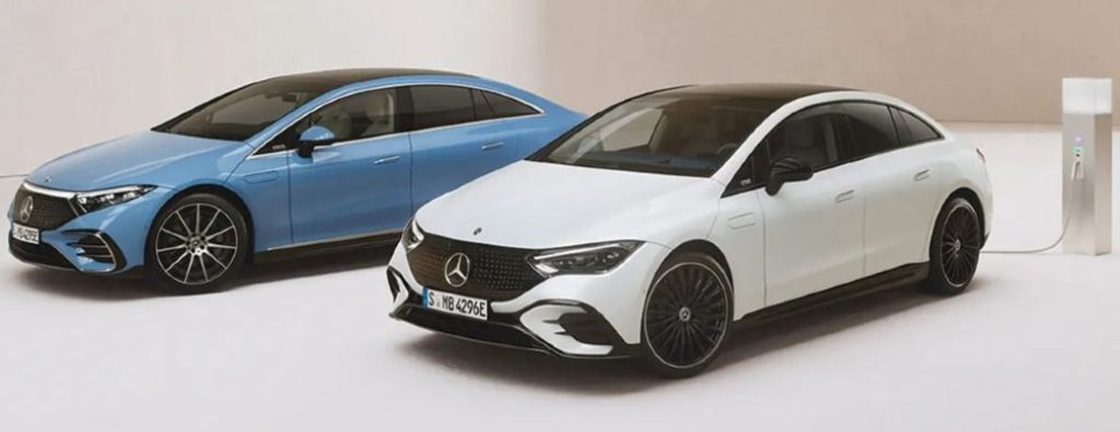 Mercedes-Benz vehicles at a charging station in a white room