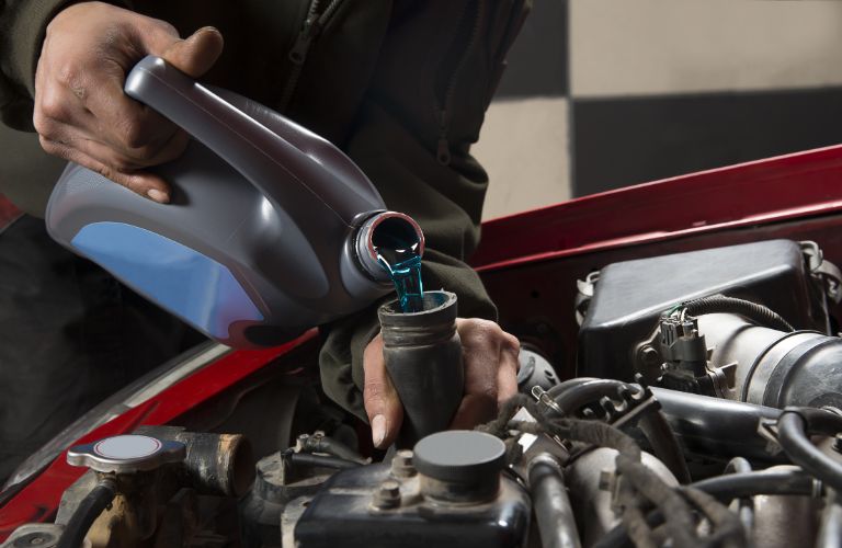 coolant being poured into the vehicle