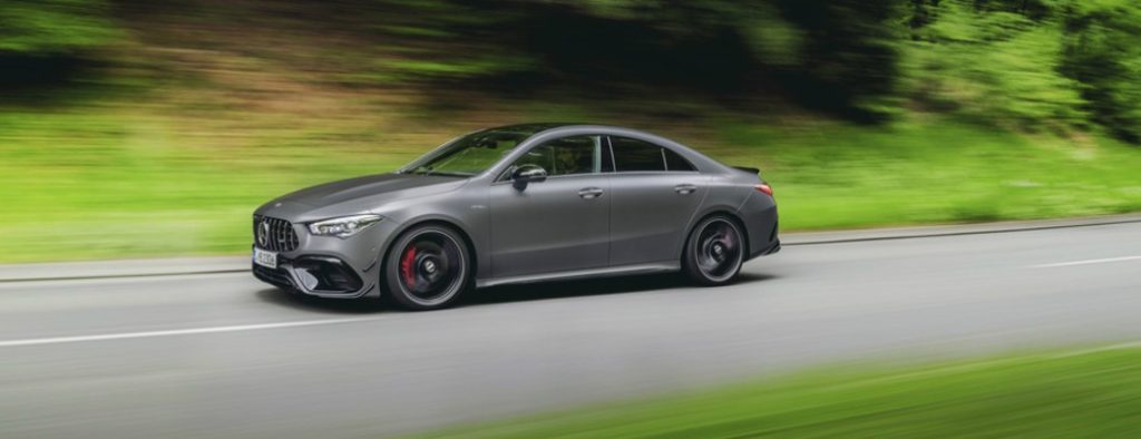 Mercedes-Benz driving fast on a road