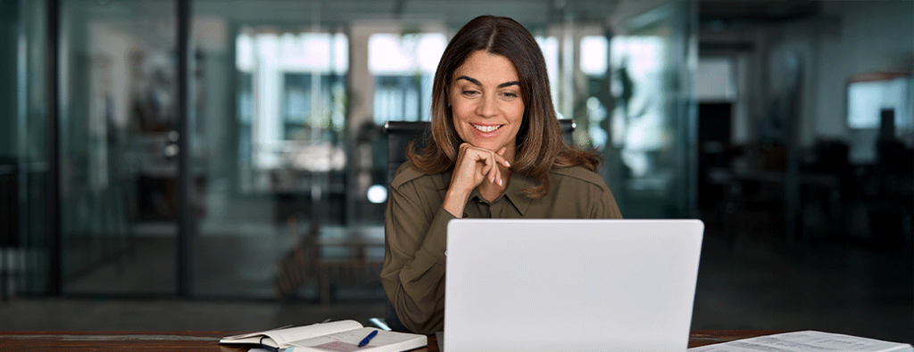 a person on a computer smiling