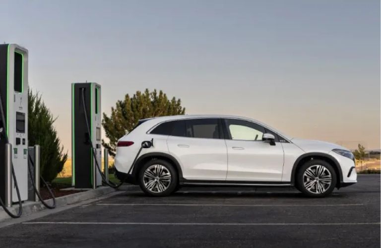 side view of the Mercedes-Benz EV at a charging station