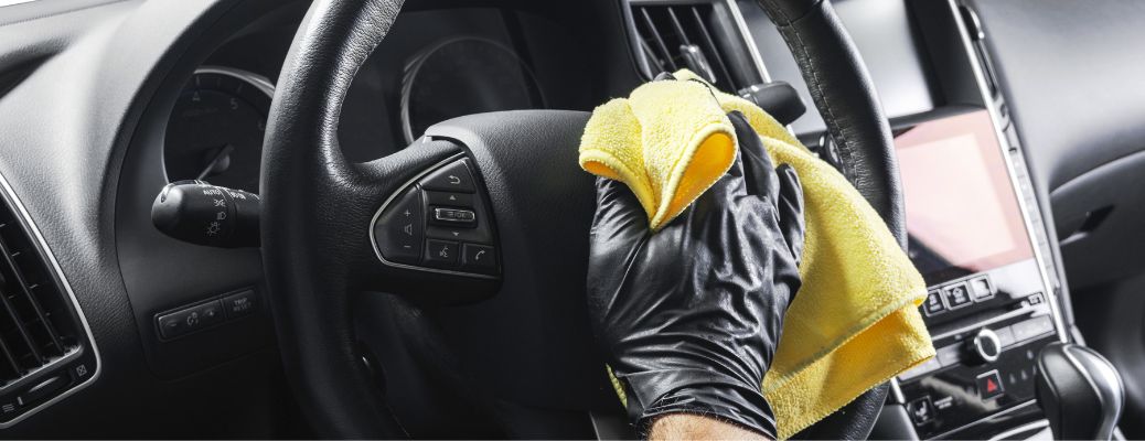 Hand of a man cleaning a vehicle