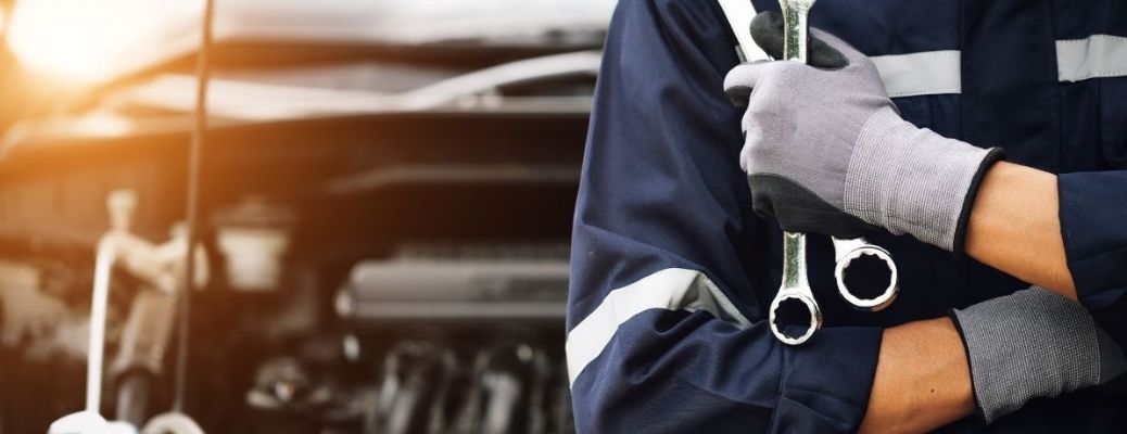 a technician holding tools