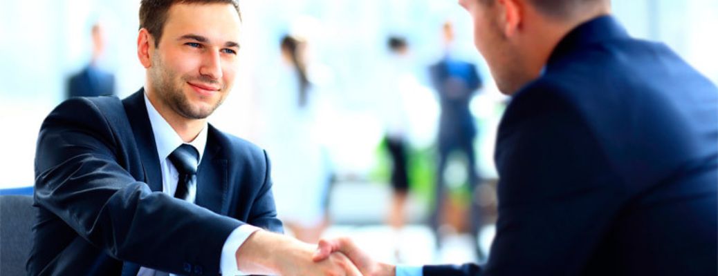 Two gentlemen shaking hands