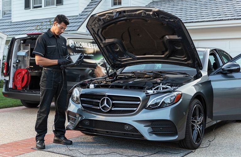 Service professional checking a vehicle