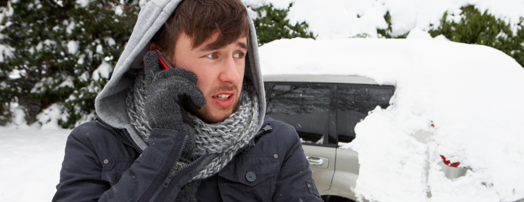 A man calling for help with broken down car