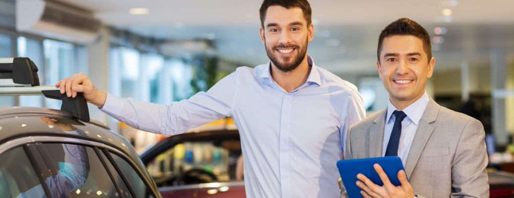 Staff posing with the vehicles