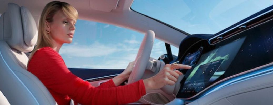 a woman driving a Mercedes-Benz