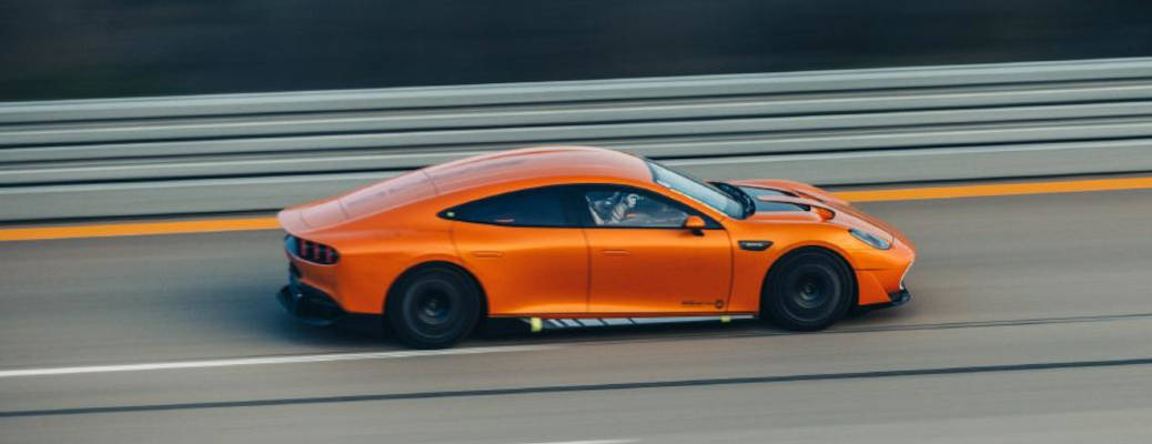 A side external view of the AMG® GT XX EV working on its distance record