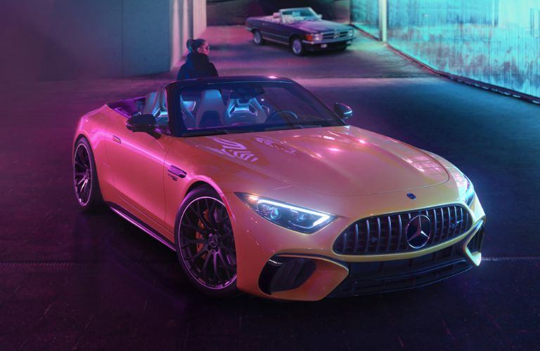 a woman in the 2026 AMG® GT