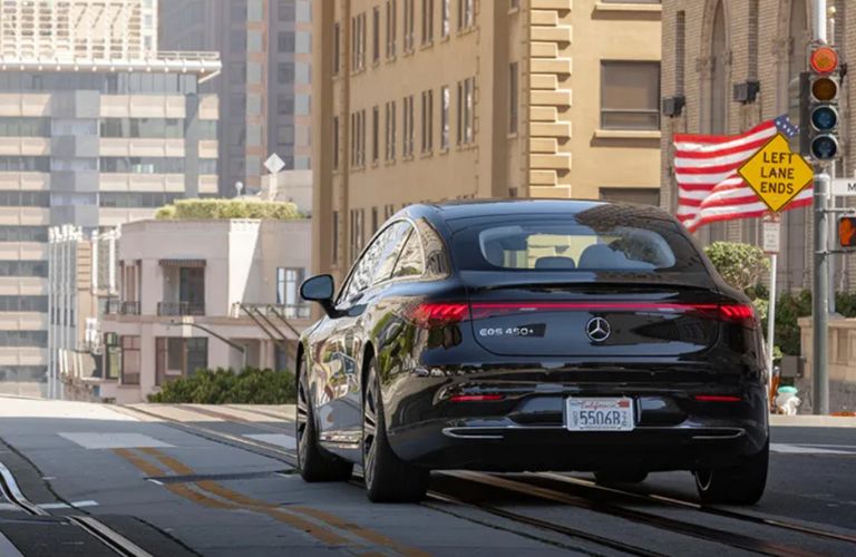 rear view of a Mercedes-Benz EV going away on the road