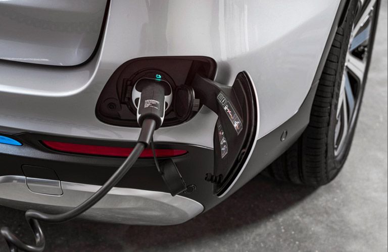 close up of a Mercedes-Benz EV getting charged