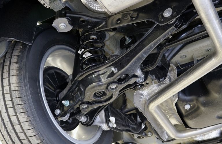 close up of a car's suspension being fixed