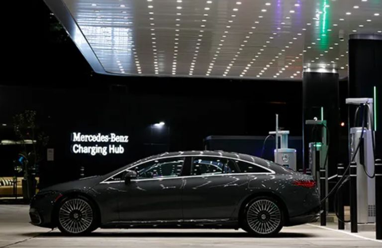 side view of a Mercedes-Benz getting charged